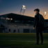 Young football player arriving at the training ground of a new club, playing football abroad